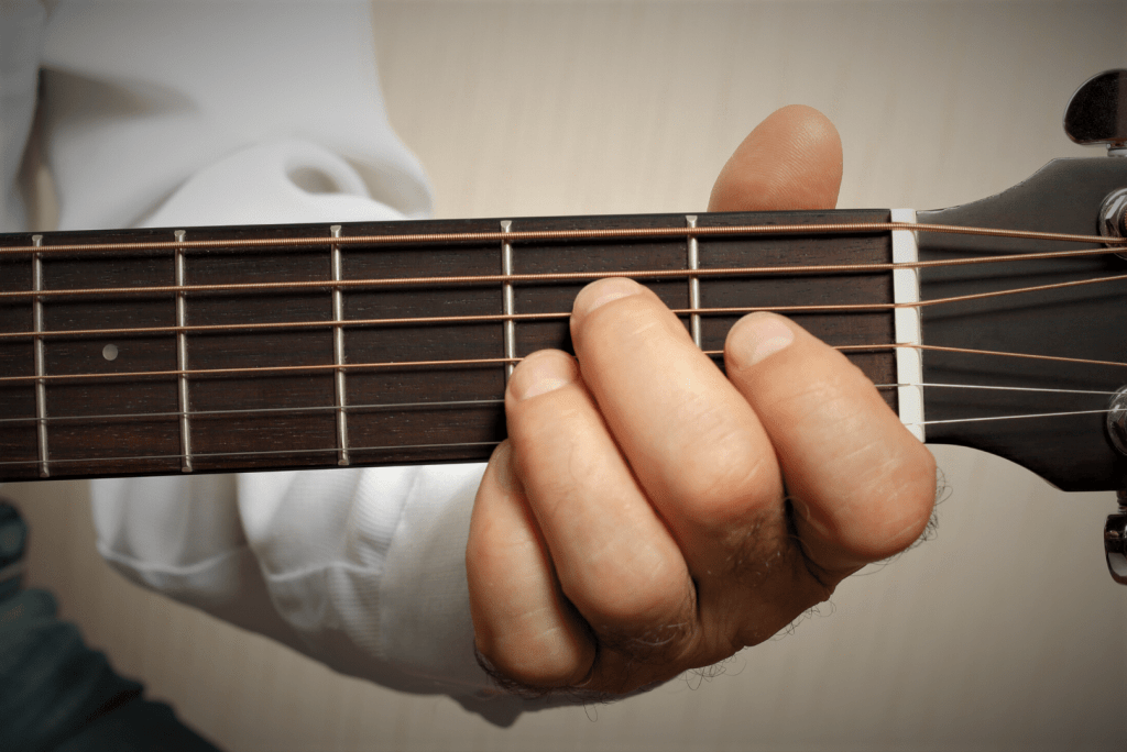 white stained guitar