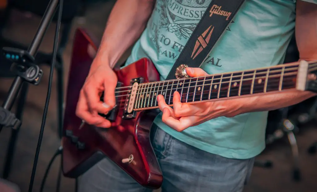 Guitar player playing gibson explorer