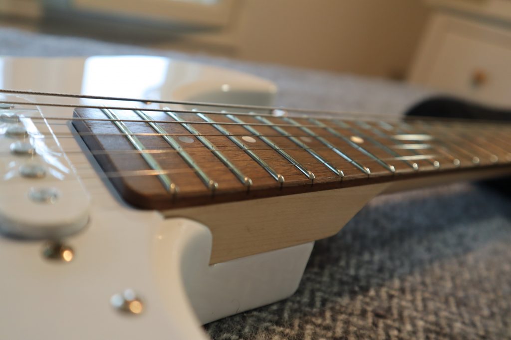 photo displays fretboard of Yamaha Pacifica 012