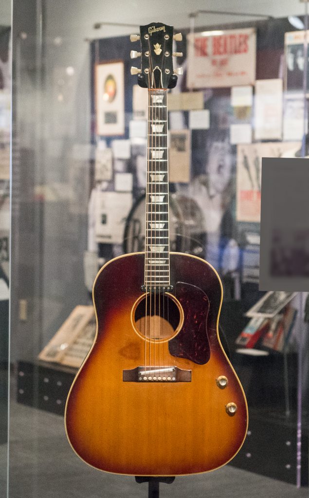 displays John Lennon's 1962 Gibson J-160E acoustic guitar