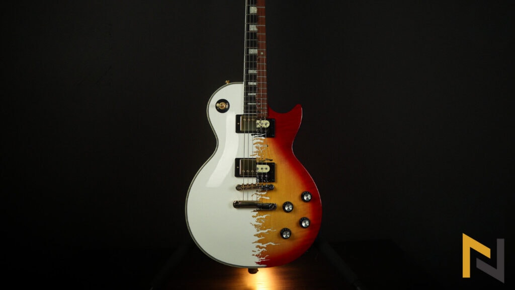 Displays 2 Epiphone guitars, Epipone Les Paul Custom and Epiphone Les Paul Studio E1