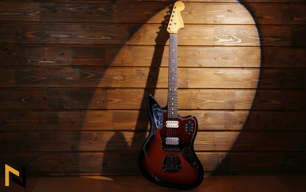 displays electric guitar on a spotlight
