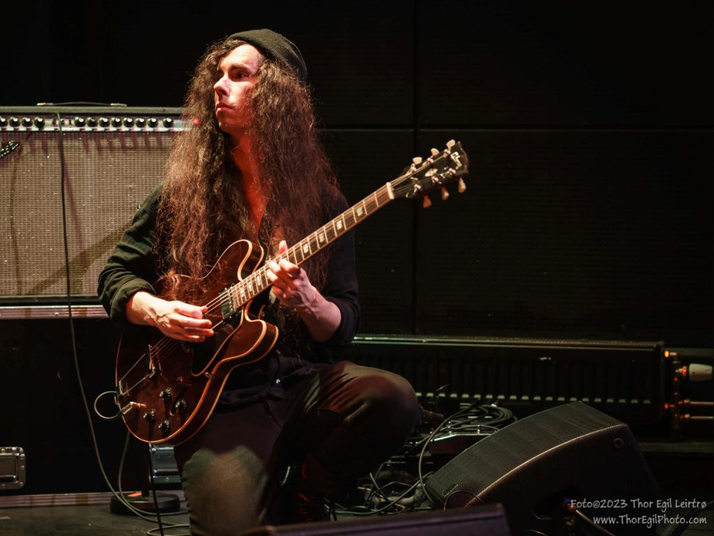 displays Edward Bond and Gibson Guitar